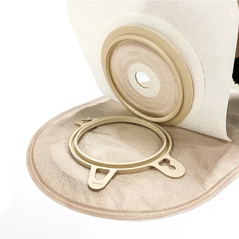 Detailed view of locking ring connection between ostomy pouch and baseplate